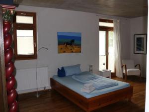 Postel nebo postele na pokoji v ubytování Holiday home in Murnau with swimming pool