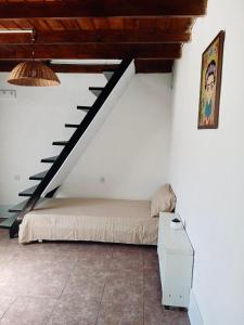 En eller flere senge i et værelse på Alojamiento TORRES