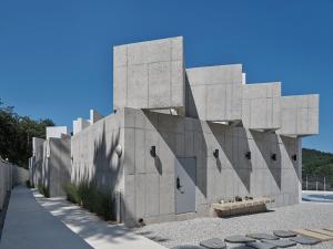 a large concrete building with at Buan Intaglio Pool Villa in Buan