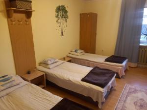 a room with three beds in a room at Owocowa Chojnata in Chojnata