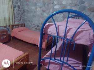 En eller flere senge i et værelse på El Descanso