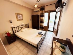 Ένα ή περισσότερα κρεβάτια σε δωμάτιο στο Thassos Studio