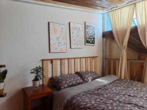 a bedroom with a bed and a window at MOre home 2 - ngôi nhà nghĩ dưỡng tại Đà Lạt in Da Lat