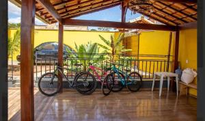 a group of bikes parked on a balcony at Casa amarela in Santana do Riacho