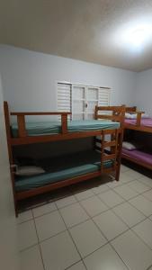 En eller flere senge i et værelse på Casatemporadapadilha