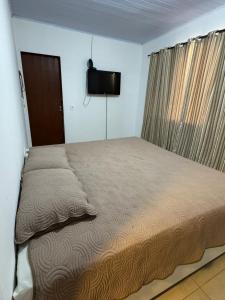 Postel nebo postele na pokoji v ubytování Casa Aconchego da Vó Gera + 6 fotografií