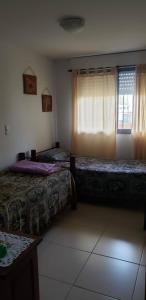 En eller flere senge i et værelse på Samay