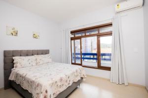 Postel nebo postele na pokoji v ubytování Bela e Aconchegante