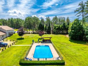 an aerial view of a backyard with a swimming pool at Cozy ski cabin #3, 3 beds in Bethel
