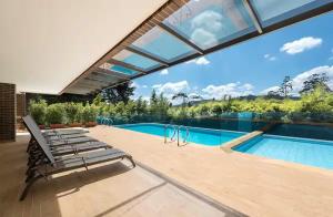 an image of a swimming pool in a house at Apartamentos Casa Grande in Rionegro