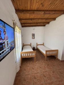 En eller flere senge i et værelse på El descanso