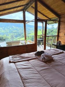 En eller flere senge i et værelse på Glamping Mirador al Cielo