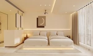 a bedroom with two white beds in it at THAT MAY Hotel-Private Travel Guide & Cultural Exchange by Li River and Rock Climbing in Yangshuo