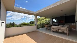 a large room with a balcony with a bench at Escapada Premium en San Bernardino! Toledo House in San Bernardino