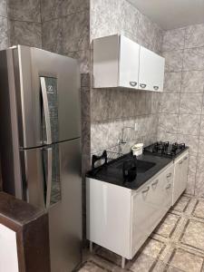 Η κουζίνα ή μικρή κουζίνα στο Casa na praia para até 8 pessoas com ótima localização +5 φωτογραφίες