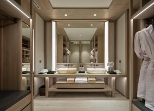 a bathroom with two sinks and a large mirror at Soori Penang in George Town