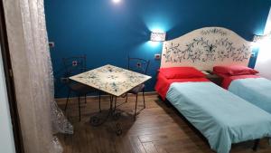 Postel nebo postele na pokoji v ubytování B&B La Tartaruga