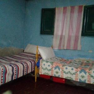 Postel nebo postele na pokoji v ubytování Apart Tunuyan