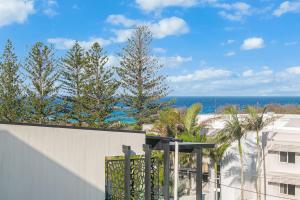 a view of the ocean from the balcony of a building at Endless Horizon in Kingscliff