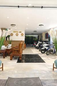 a room with a bunch of motorcycles parked in it at 10h Hotel in Ho Chi Minh City