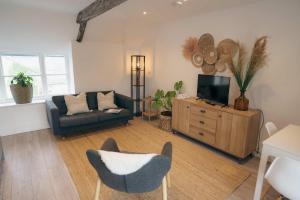 Posezení v ubytování Contemporary Chic Stylish Apartment in Tetbury + 14 fotografií