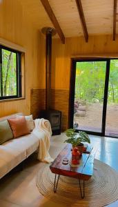 Et opholdsområde på Cabaña Alto del Bosque