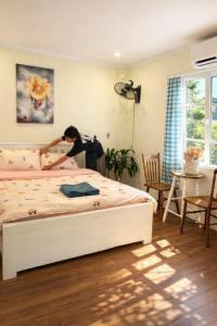 Postel nebo postele na pokoji v ubytování HCA Homestay