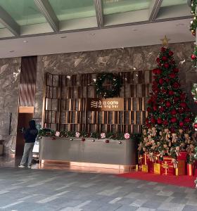 a christmas tree in the lobby of a hotel at À La Carte Ha Long Studio Apartment- Sea View Room in Ha Long +70 photos