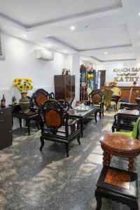 a room with chairs and tables in a store at Kathy Hotel in Ho Chi Minh City +34 photos
