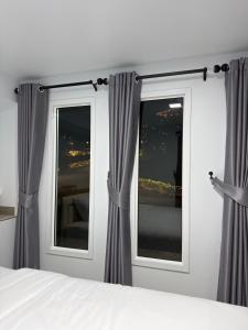 En eller flere senge i et værelse på Siriwan boutique hotel + 2 billeder