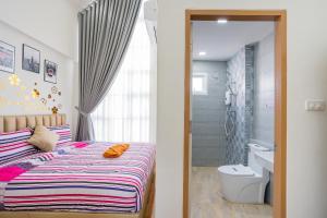 a bedroom with a bed and a bathroom with a shower at Sea Fan Cha-am Pool Villa in Ban Bo Prakhon +35 photos