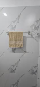 a towel is hanging on a marble table at Nine Arch Wood Cabin in Ella +97 photos