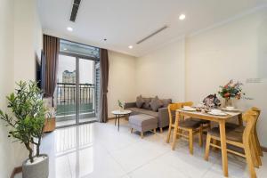 a living room with a couch and a table at Luminous Landmark Apartment in Ho Chi Minh City