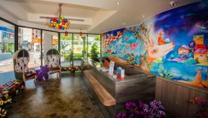 a store with a large mural on the wall at Legend Hotel Kaohsiung Pier2 in Kaohsiung
