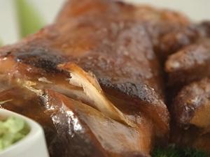 a close up of a piece of meat with a dip at Ciriaco Hotel in Rauis