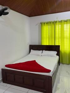 En eller flere senge i et værelse på MaryLand Homestays + 14 billeder