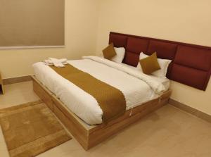 Giường trong phòng chung tại Hotel SJ corporate +26 ảnh