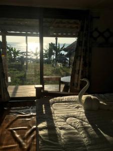 Ένα ή περισσότερα κρεβάτια σε δωμάτιο στο The Sunset View Lanta