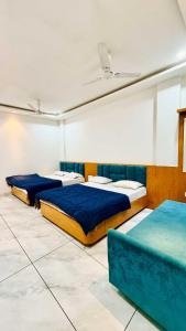 Postel nebo postele na pokoji v ubytování Hotel Raj Inn