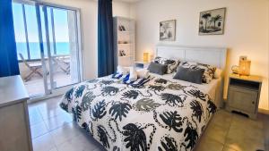 En eller flere senge i et værelse på Chalet a orillas del mar