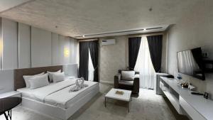 TV a/nebo společenská místnost v ubytování Ohu Palace Hotel