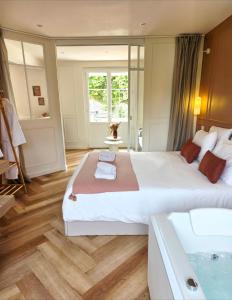 En eller flere senge i et værelse på Le Boudoir d'Elba - Balneotherapie & terrasse