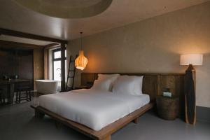 Ένα ή περισσότερα κρεβάτια σε δωμάτιο στο TOKI Boutique Hotel Tam Đảo