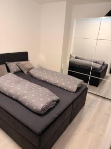 En eller flere senge i et værelse på Komfortable moderne Ferienwohnung 43 qm