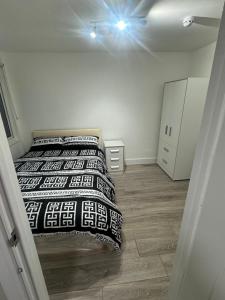 a bedroom with two beds in a room at Systematic Home in Battlesbridge +4 photos