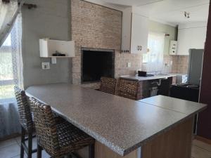 a kitchen with a large counter top in a room at Magic Flame farm in Hopefield