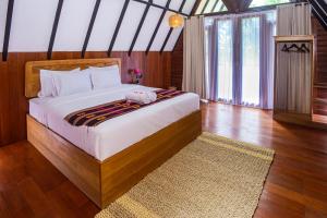 Een bed of bedden in een kamer bij New Bintang Mandalika