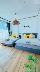 a bedroom with two beds and a chandelier at HappyDaysVilla in Ko Larn +45 photos