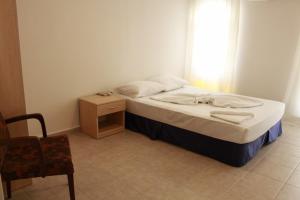 Ένα ή περισσότερα κρεβάτια σε δωμάτιο στο Denizci Pension