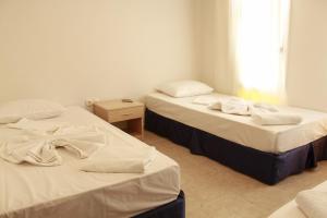 Ліжко або ліжка в номері Denizci Pension